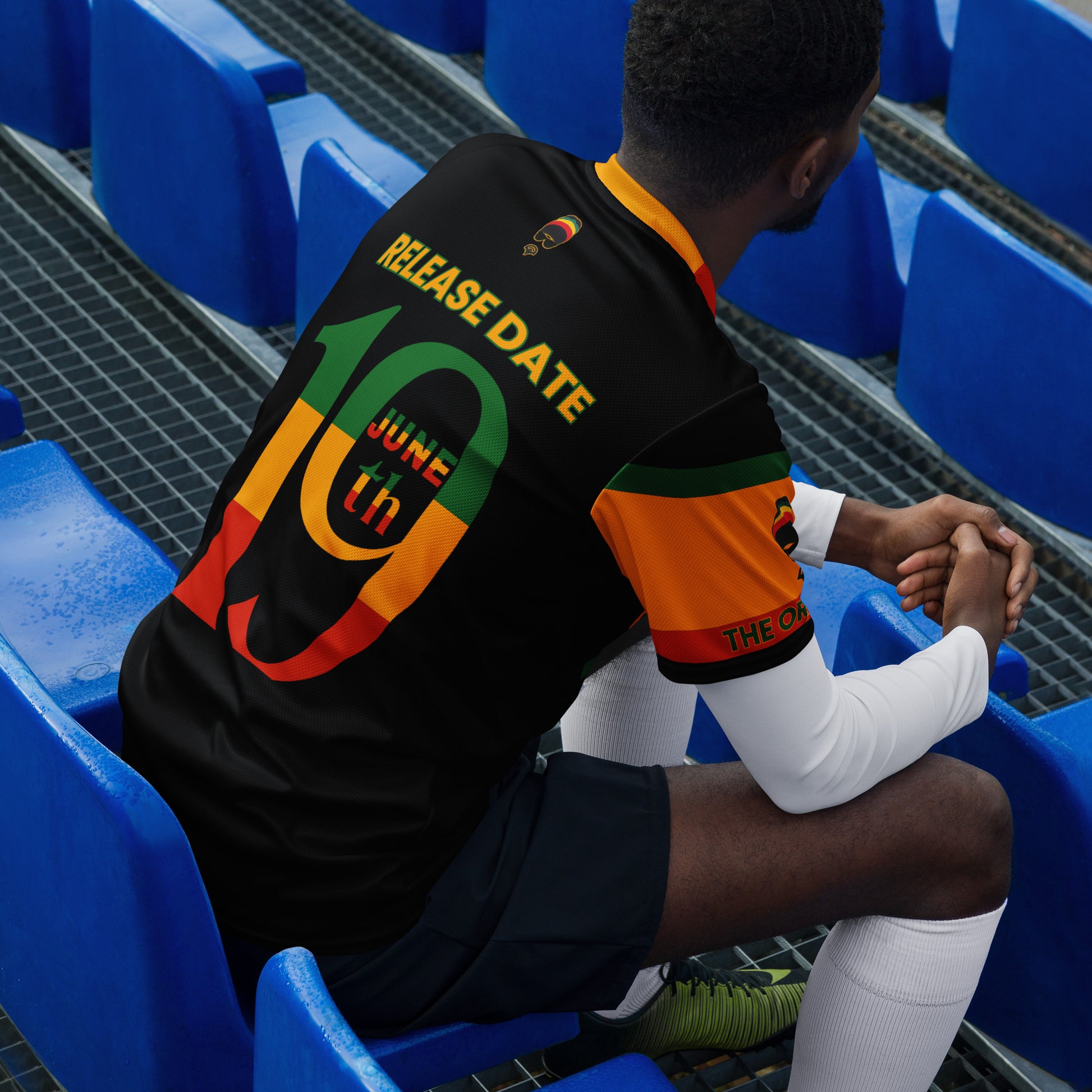 - “Afro-Caribbean jersey with red, gold, and green Rasta colors and number 19 design”