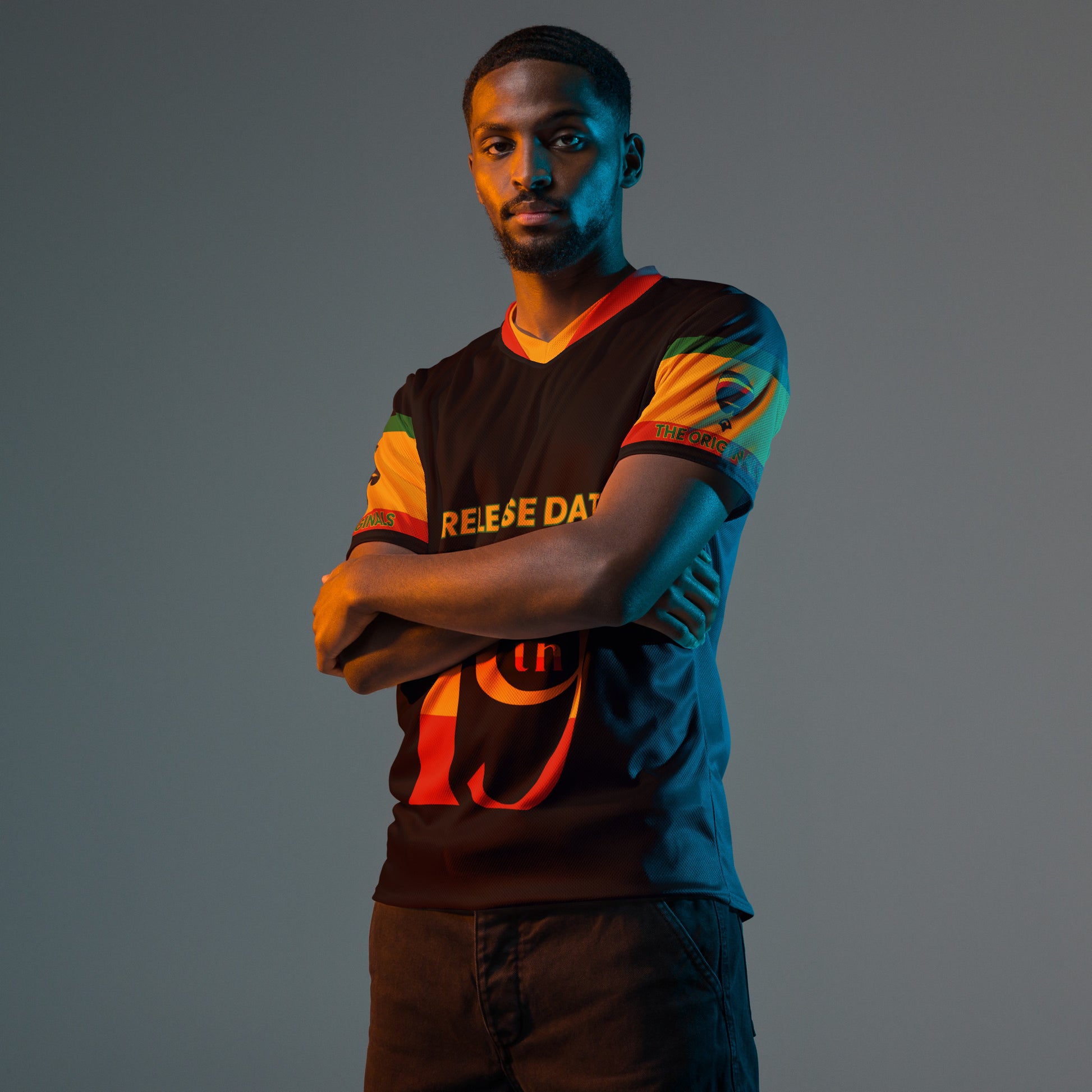 - “Afro-Caribbean jersey with red, gold, and green Rasta colors and number 19 design”