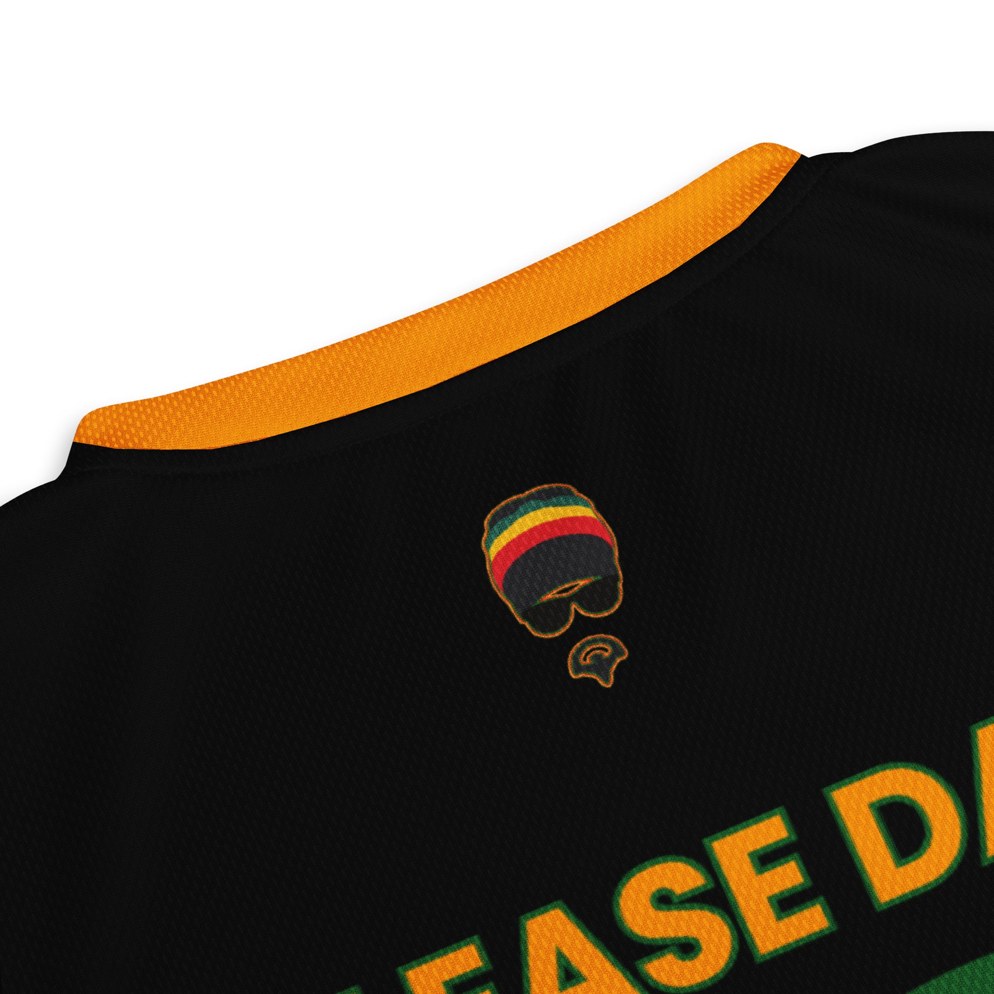 - “Afro-Caribbean jersey with red, gold, and green Rasta colors and number 19 design”